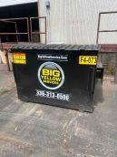 4 Yard Commercial Front Load Dumpster placed behind office building
